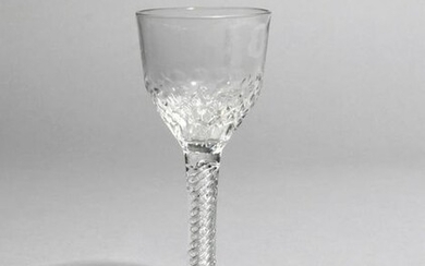 A wine glass c.1760-65, the ogee bowl moulded...