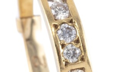 AN 18CT GOLD DIAMOND RING; channel and gypsy set with 8 round brilliant cut diamonds totalling approx. 0.25ct, size Q, wt. 2.63g.