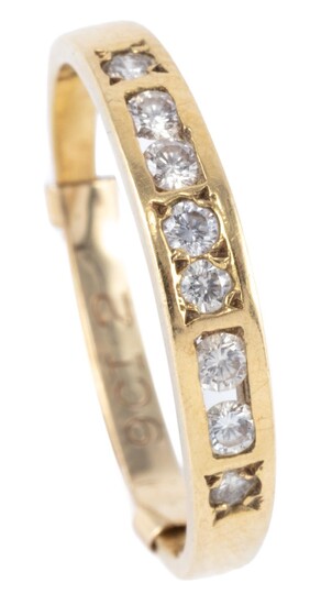 AN 18CT GOLD DIAMOND RING; channel and gypsy set with 8 round brilliant cut diamonds totalling approx. 0.25ct, size Q, wt. 2.63g.