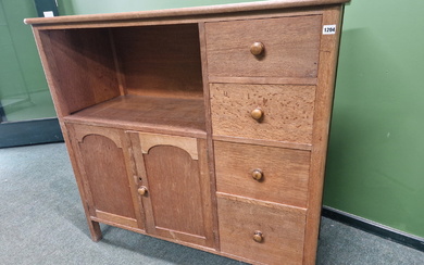 AN ARTS AND CRAFTS STYLE OAK SIDE CABINET IN THE MANNER OF HEALS.