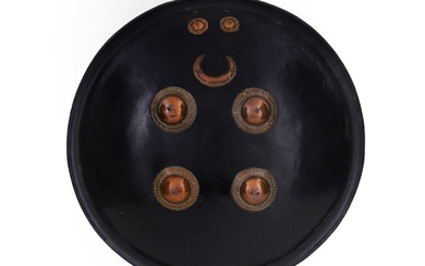 AN INDIAN DHAL SHIELD WITH LACQUERED HIDE, 19TH C.