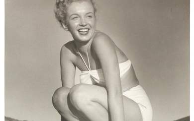 ANDRE DE DIENES (ROMANIAN/AMERICAN, B.1913-D.1985): a black and white print of Marilyn Monroe on Torbay Beach, 1949