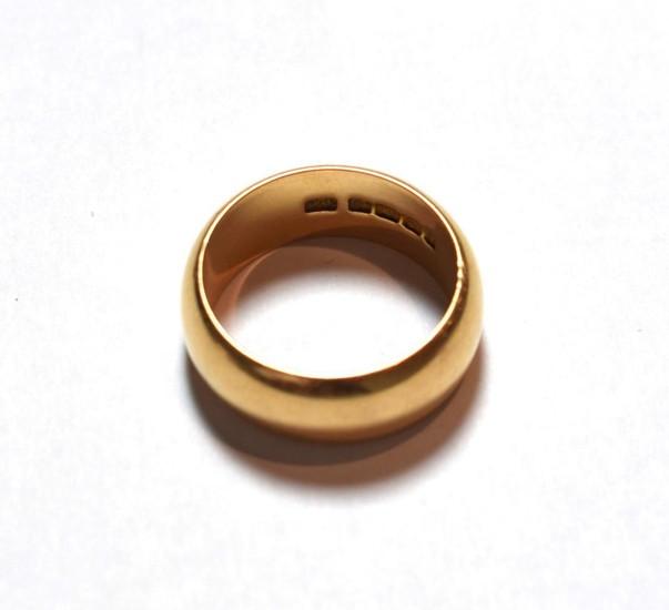 An 18 carat gold band ring, finger size V