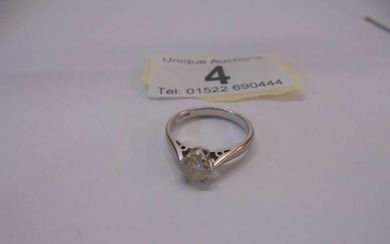 An 18ct white and yellow gold ring set single stone diamond,...