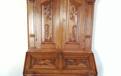 An 18th century baroque oak bureau. Two keys. H. 222. W. 114. D. 35/60 cm.