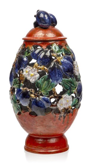 An Austrian Pottery terracotta openwork vase and cover in the Viennese Gmundner style, c.1920, indistinct pottery marks, impressed Made in Austria and 115, The oviform reticulated and decorated with plums, leaves and flowers, colourfully glazed...