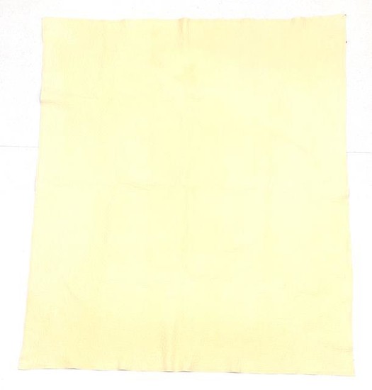 An Early 20th Century Wholecloth Quilt, with primrose yellow cotton...