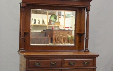 An Edwardian Arts and Crafts mahogany mirror back side cabinet, fitted with two drawers above a cupb