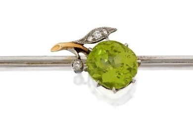 An Edwardian, peridot and diamond set brooch, designed as a cushion-shaped peridot apple, with diamond leaf detail, c.1905, approx. length 6cm, in fitted case