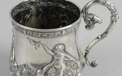 An Edwardian silver mug, of baluster form with scroll