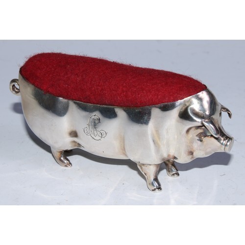 An Edwardian silver novelty pin cushion, as a pig, 11cm long...