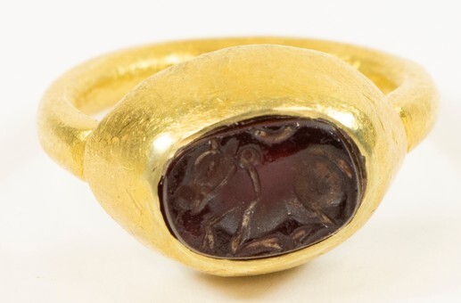 An antique 18k yellow gold Nandi signet ring with an...
