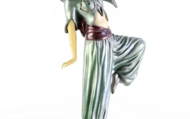An art deco gypsy dancer in cold painted bronze paste set and with celluloid, on a stepped onyx base