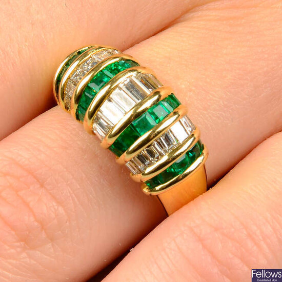 An emerald and baguette-cut diamond dress ring.