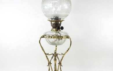 An ornate 19th century brass oil lamp, with an etched...