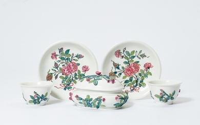 An oval Meissen Böttger porcelain sugar box and two tea bowls from a service with rosebud relief
