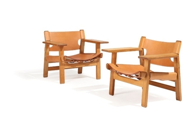 Børge Mogensen: “The Spanish Chair”. A pair of solid oak armchairs, seat and back with natural leather. Manufactured by Fredericia Stolefabrik. (2)