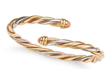CARTIER, A TRICOLOUR GOLD AND CORAL BANGLE in 18ct yellow, white and rose gold, the open cuff ban...