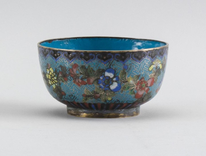 CHINESE CLOISONNÉ ENAMEL BOWL With gilt rim, turquoise interior and colorful exterior decoration of a floral design on a turquoise g...