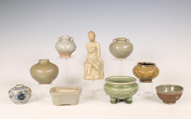 China and Southeast Asia, a collection of celadon and cream-glazed jars and a figure, Ming dynasty (1368-1644) and later
