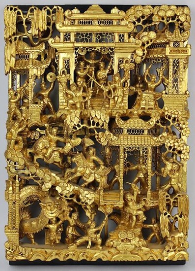 Chinese panel, wood richly carved and gilded, detailed openwork, stylized buildings in landscape, in it numerous fully plastic figures, musicians, dancers, actors, 43 x 30 cm, D 5 cm, few insignificant outbreaks. 2483-017
