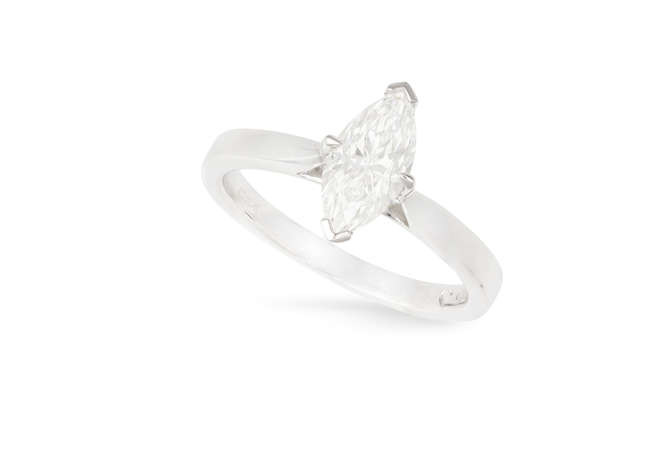 Description A DIAMOND SINGLE-STONE RING The marquise-shaped diamond weighing...