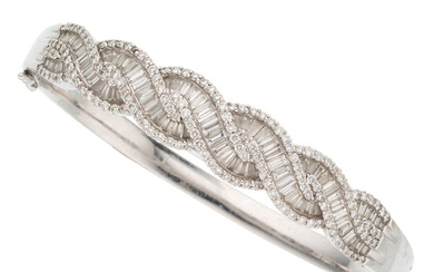Diamond, White Gold Bracelet The bracelet features baguette-cut diamonds...