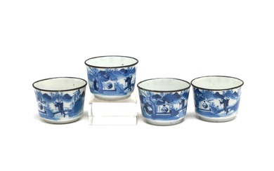 Four blue and white porcelain teacups each painted with landscape design and Chinese literature