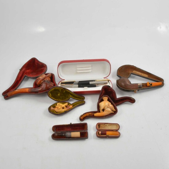 Four cased carved meerschaum pipes, two cased cheroots, and Parker and other brand pens.