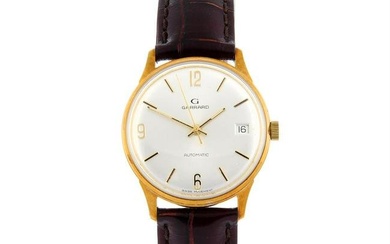 GARRARD - a 9ct yellow gold wrist watch, 34mm.