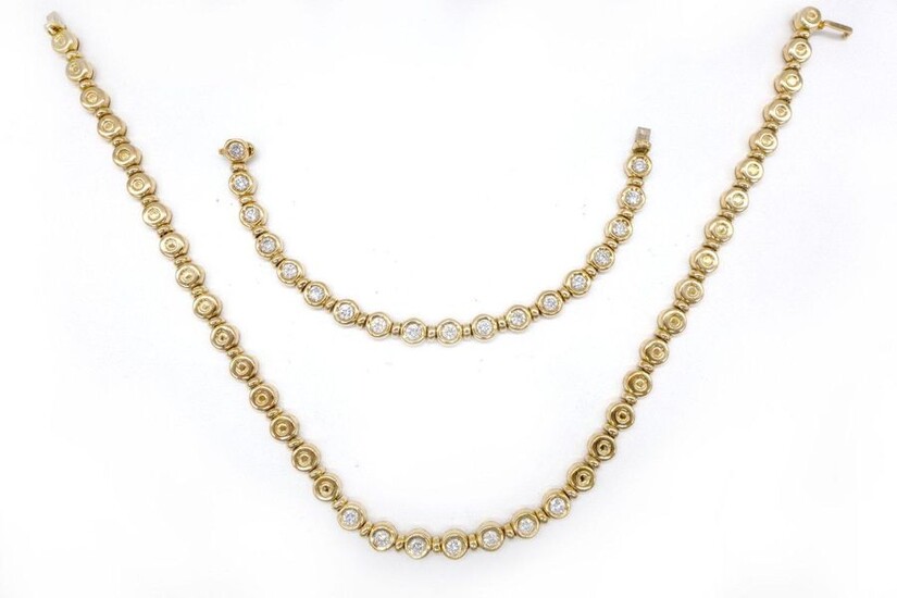 HALF SET comprising an 18K yellow gold NECKLACE made up of round links holding 7 brilliant-cut diamonds of approximately 0.25 carat and an 18K yellow gold BRACELET made up of round links holding 18 brilliant-cut diamonds of approximately 0.35 carat...