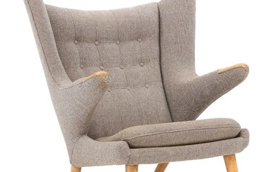 Hans J. Wegner: “Papa Bear”. Easy chair with legs and nails of beech, upholstered with brown/grey flecked wool.
