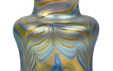 Loetz (Austrian), an iridescent Phaenomen dimpled glass vase with everted rim, c.1900, PG 202, PN 11/888, ground out pontil engraved Loetz Austria, Pale glass body decorated with silvery-blue and blue shaped banding pulled to a point, 17.2 cm high...