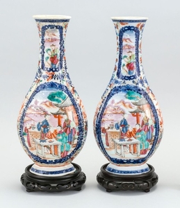 PAIR OF CHINESE EXPORT FAMILLE ROSE PORCELAIN VASES In bladder form with elongated necks ending in quatrefoil mouths. Bodies with fi...