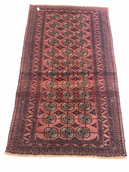 Persian Bokhara red ground rug, gul motif on red...
