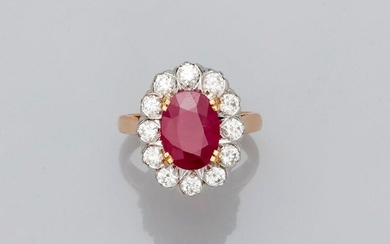 Ring " Pompadour " two golds, 750 MM, centered of an oval ruby, Burmese origin weighing 3,43 carats in a row of brilliants, total 1 carat, certificate of the GGT laboratory, size: 55, weight: 8,35gr. gross.