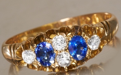 SAPPHIRE AND DIAMOND RING, 18 ct. gold. Vibrant blue sapphir...