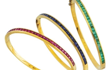 SET of three yellow gold hoop bracelets with...