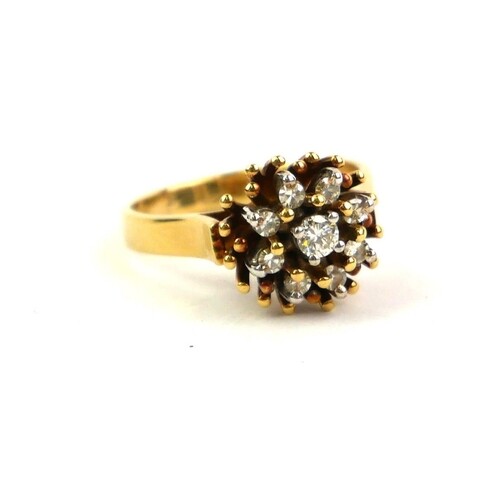 STARLIGHT, AN 18CT GOLD AND DIAMOND CLUSTER RING Having an a...