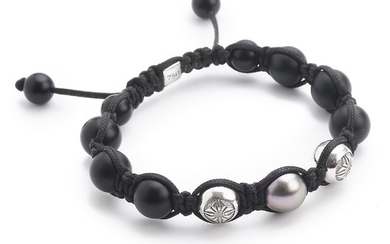 Shamballa: An onyx and diamond bracelet set with a cultured Tahiti pearl, onyx beads and brilliant-cut diamonds, mounted in 18k white gold and black braid. G/VS