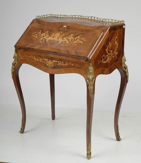 Small Louis XV style sloping desk known as "Dos d'âne" in light wood veneer with curly veneer and light wood marquetry with "Rocaille" decor opening on a leaf giving on three drawers and storage space. Ornamentation and gilded bronze gallery. Period:...