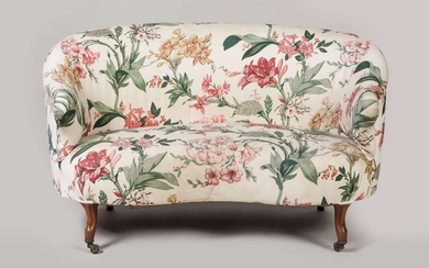 Sofa de forme corbeille mouvementée, piètements antérieurs sur roulettes, fin XIXe siècle (usures à la...