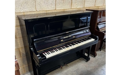 Steinway (c1923) A Model K upright piano in an ebonised case...