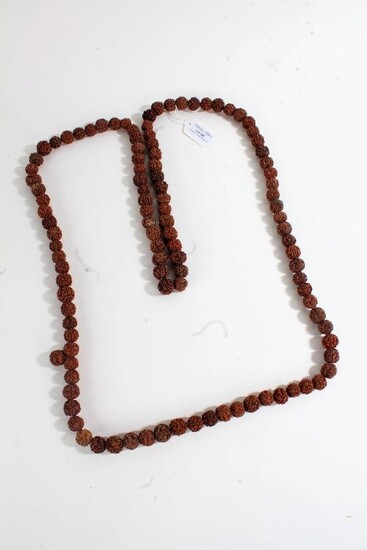 String of prayer beads formed from dried seeds/nuts, 88cm long