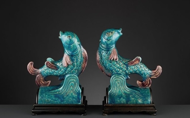 TWO AUBERGINE AND TURQUOISE GLAZED ‘FISH’ ROOF TILES,...