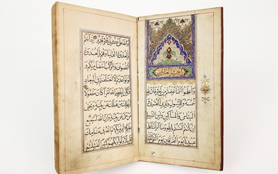 Texte en arabe relié en "cuir marocain" avec sur la première page un "mihrab" en...