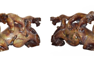 A pair of 20th century Chinese mottled hardstone carvings...