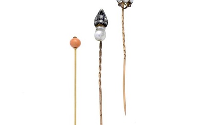 Three tie pins in yellow gold, low title gold, pearl, coral and diamonds