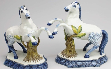 Two Arnhem pottery Delft style prancing horse figures