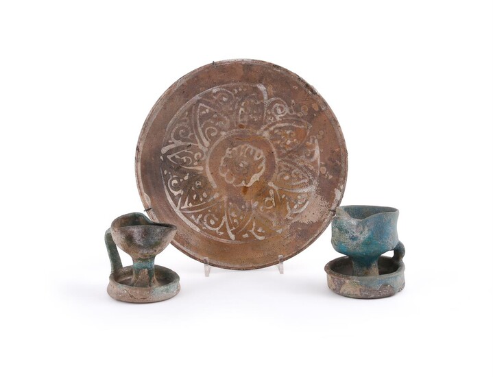 Two Kashan turquoise glazed pottery oil lamps